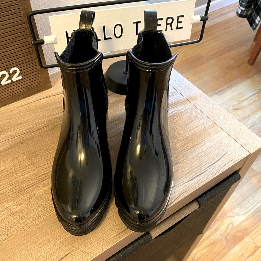 Black shiny rain boots